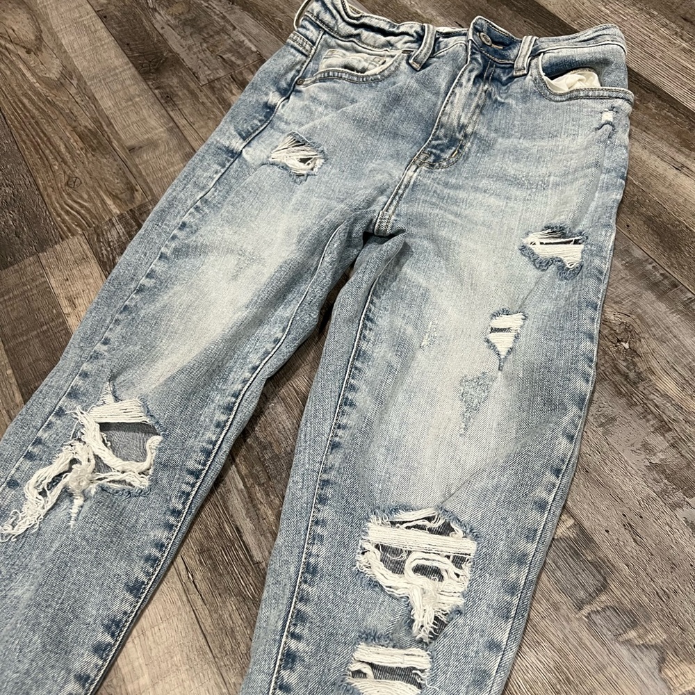 Ripped straight leg high rise jeans; never worn w/o tags